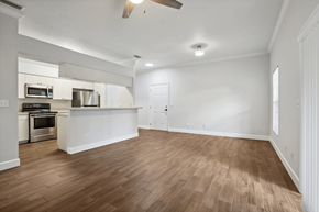 Lakeland apartment for rent - A kitchen with white cabinets and a wooden floor.